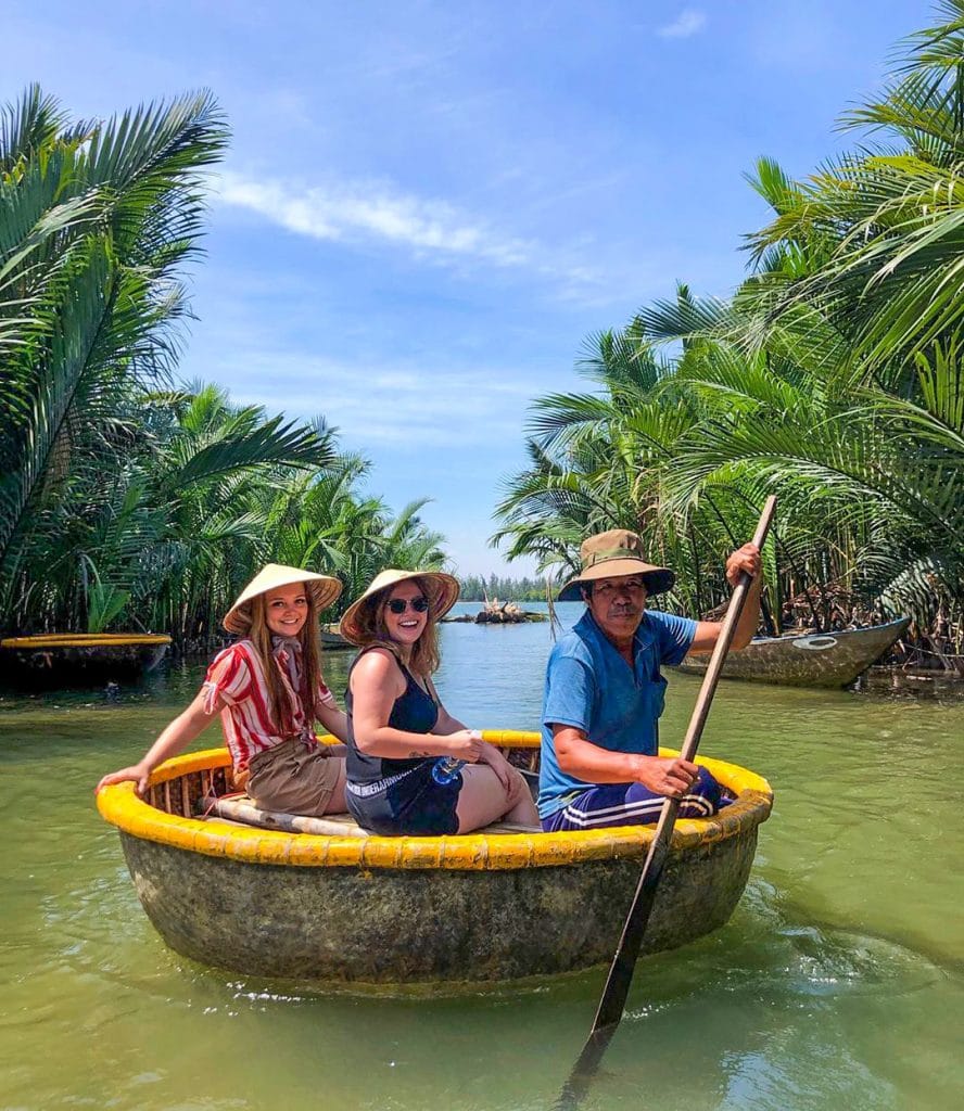 girls crab fishing in a coconut boat in Hoi An