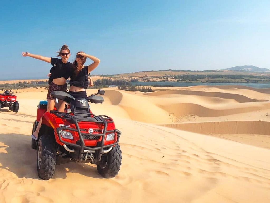 A group on a quad bike on the Sand Dunes in Vietnam