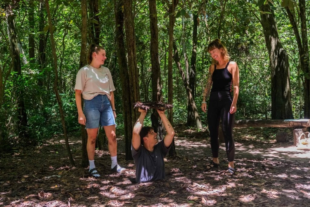 Group entering the hidden war tunnels in Vietnam 