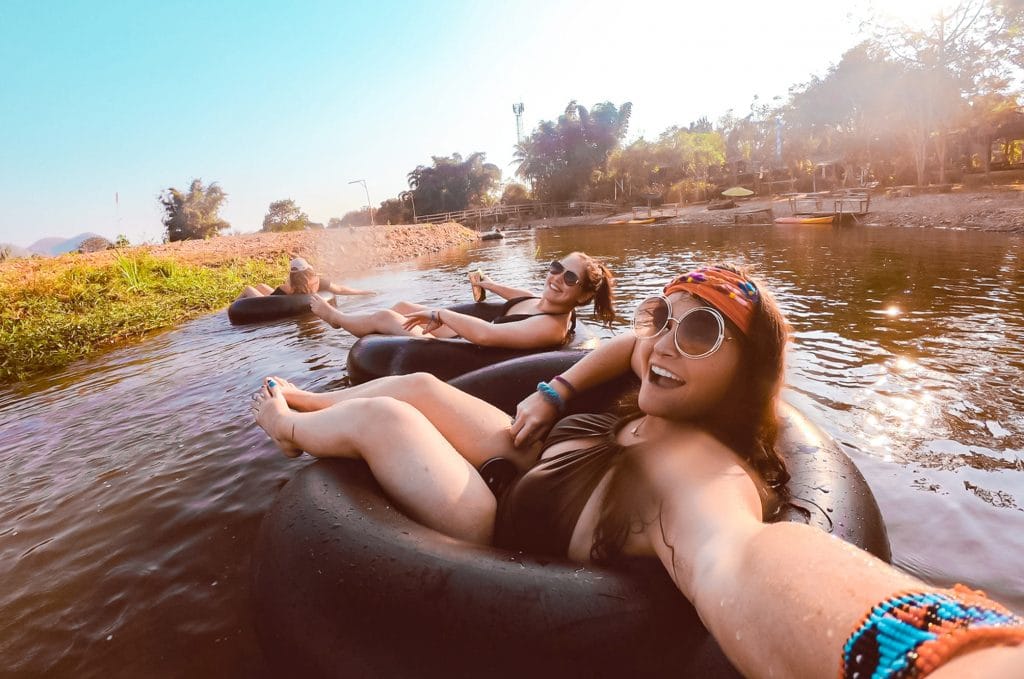 Group selfie while tubing in Pai, Thailand