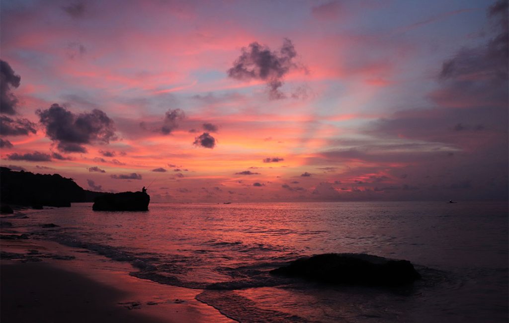 A picture of a sunset on a beach. They are one of the main reasons to visit Uluwatu: sunsets. 