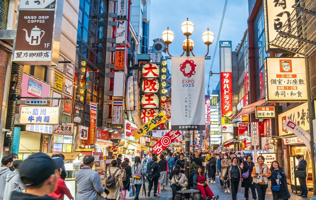 The bustling Dotonbori district in Osaka is filled with neon signs, restaurants, and crowds.